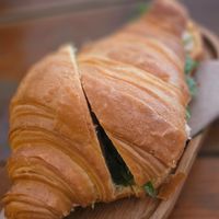 Croissant with marinated tofu, rucola and olives. at GAL Cafe in Lisbon