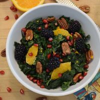Winter salad with kale, blackberries, pecans, oranges, pomegranate, with citrus vinaigrette.  at Fresh Picked Daisy in Los Angeles