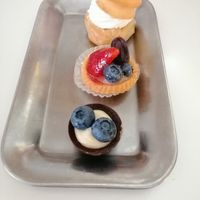 Profiterole, mini fruit tart and blue berry white and black chocolate. at Ratatouille in Turin
