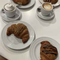 Plain croissant, chocolate croissant, pistacchio croissant, latte and hot chocolate with whipped cream  at Ratatouille in Turin