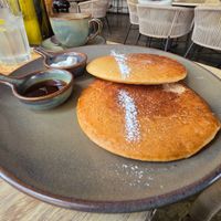 Vegan pancakes with maple syrup and coconut milk whipped cream. Very yummy! at Coffee & Plant in Nairobi