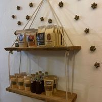 Sells coffee and other packaged goods  at Cachimba in Minca