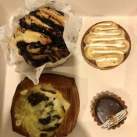 Clockwise from top left: chocolate brioche thing, lemon tart, a salted chocolate tart, and the same savoury tart as the other photo  at Maison des Lys Pâtisserie - Mt Eden in Auckland