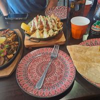 Vegan nachos with tofu and vegan fajitas with tofu mix at TNT - 66 in Croydon