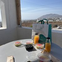 Vegan breakfast and views from balcony on day 1  at The Noverian Bios Santorini, Vegan Boutique Hotel in Santorini