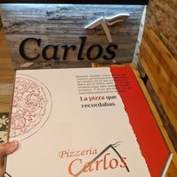 inside at Pizzería Carlos  in Madrid