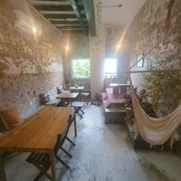 Beautiful cafe on the riverside with indoor and outdoor seating and a separate vegan menu at Vspace Guesthouse and Cafe in Malacca