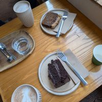 Coffee and pecan cake, chocolate fudge cake, and 2 flavoured hot chocolates to warm up at Oat and Bean in Cardiff