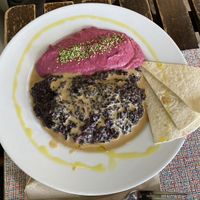 Beetroot hummus, vegan creamy black rice dish and pita breadd  at Vert & Frais in Madrid