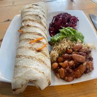 Onion bhaji wrap with small side salad  at Dave's Pop Up Vegan Cafe - temporarily closed in Knoydart