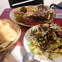 Arayes patata, hummus and mohamara combo. Fattuch salad.  at Ugarit  in Barcelona