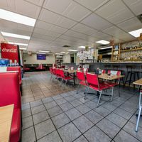 Comfy booths. at Pathway Burgers & Momos in Calgary
