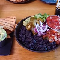 Guacamole with tortilla chips, and black bean rice bowl (black beans, corn, guacamole, red onion, red cabbage, salsa) at Batanga in York
