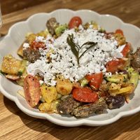 A delicious salad with vegan cheese  at Tiny Rebels in Crete