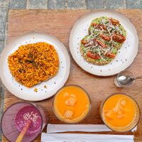 Egg scramble toasts, avocado toasts, orange juices and smoothie at Tiny Rebels in Crete