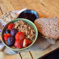 Vegan breakfast with: vegan yoghurt with granola, bread with jam, vegan scramble, tea or coffee and jus at Corazon Bakery in Amersfoort