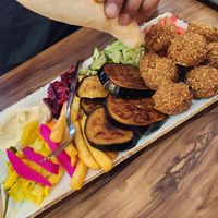 Falafel, eggplant and chips plate. Served with warm Turkish bread at Abu Noaas in Fawkner