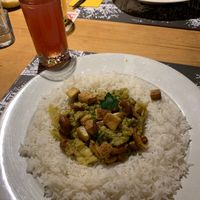 Homemade ice tea with rice and curry at Brasserie Lorraine in Bern