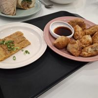 Not sure what the left dish is, something eggy? Dumplings right   at Loving Hut - Real Love in Seoul