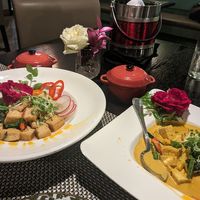 Coconut curry with bean curd and vegetables and sauteed spicy bean curd with herbs and vegetables at Herb in Chicago