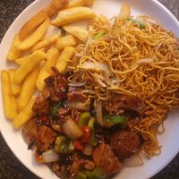 Vegan House Special in Green Pepper & Black Bean Sauce with chips and noodles at 105 Cantonese Takeaway in Wilmslow