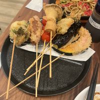 Vegan Kushikatsu with plat based sauce. Yakisoba I’m the background.  at Pivot BASE Cafe & Bar ＠Dotonbori in Osaka