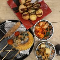 Takoyaki, kushikatsu (fried vegetable skewers), kimchi 3 kinds, and pickles  at Pivot BASE Cafe & Bar ＠Dotonbori in Osaka