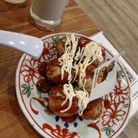 Standard takoyaki and ice coffee (background) at Pivot BASE Cafe & Bar ＠Dotonbori in Osaka
