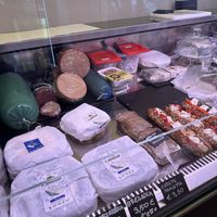 Vegan meats and cheese in case  at Fermaggio Bistrot & Store in Rome