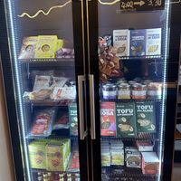 Cooler loaded with vegan meats  at Fermaggio Bistrot & Store in Rome