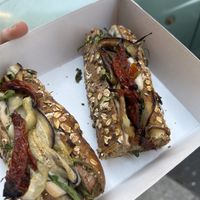 baguette with vegan mozzarella, eggplant, sun-dried tomatoes, and arugula  at Fermaggio Bistrot & Store in Rome