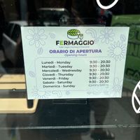 Paper over old hours on Sunday  at Fermaggio Bistrot & Store in Rome