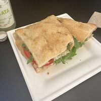 stracciatella stuffed pizza with extra tomato’s   at Fermaggio Bistrot & Store in Rome
