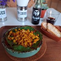 Scrumble Tofu Shakshouka. Veg and chickpeas in tomato sauce with scrambled tofu spinach and bread at El Michi del Puerto in Tenerife