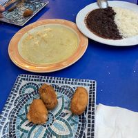 Yucca in garlic (all gone!), black beans and rice (half portion) and croquettes (most already eaten!)  at Habanita in Sevilla