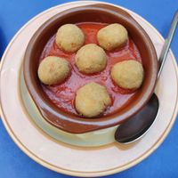 Breaded plantain balls in tomato sauce. at Habanita in Sevilla