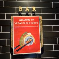 Small restaurant sign inside at the top of the staircase   at Vegan Sushi Tokyo in Tokyo