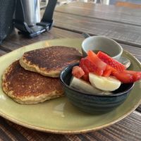 Pancakes with fruit and maple syrup   at Emilia Brunch & Cocktails in Guimaraes