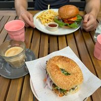 The Shack Burger with fries and Sa'mon cream cheese bagel at Velicious Café in North Narrabeen