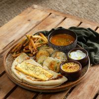 Vegetarian platter with halloumi cheese, fried crispy zucchinis, lentils, hummus and other beauty at Elamu Lombok in 