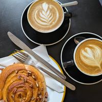 Banana and pecan bun. Oat flat whites. at HQ Urban Kitchen in Swansea