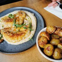 Cauliflower steak and potatoes at Food For Fit  in Sliema