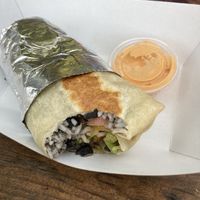 Burrito with volcano tempeh (vegan sauces are chimichurri - very garlicky but good - and sriracha aioli   at Muñecas Taco Garden and Bar in Gainesville