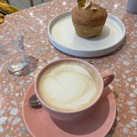 Oat milk coffee and breakfast muffin    at Cafe Good in Munich
