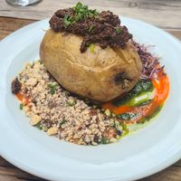 Entrée: roasted potato, with nuts, sprouted grains, pesto sauce and olive tapenade. at Le Potager du Marais - Saint Paul in Paris