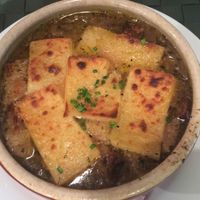 Best vegan French onion soup in the world. This photo does not do justice to this wonderful soup. The artisanal vegan cheese on top was amazing, the french bread in this soup was incredible and had more character than any of the french breads I've ever had in France, the onions are caramelized with a perfect texture allowing a wide variety of flavors to peak from the onions, the complex mix of spices and flavors in this were mind-blowing. I happened to take a non-veg co-worker to this wonderful restaurant and the look of shock on their face after trying this was priceless. They even admitted without me saying anything that this was the best soup they had ever had. Absolutely amazing. at Le Potager du Marais - Saint Paul in Paris