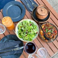 Spicy Georgian herb salad, freshly squeezed carrot-apple juice, Georgian ratatouille at Gastro Hub in Helsinki