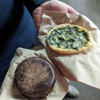 Alfajor "dark chocolate" and mini savory pastry at True Munchies in Lisbon