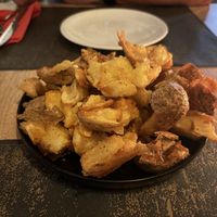 Smashed potatoes. They come with a cheese dip but that is on the side  at Colombo Kitchen & Bar in Crete