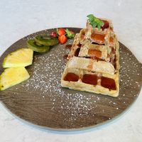 Waffle pyramid with strawberry jam 🍓   at Lemon Garden in Gothenburg